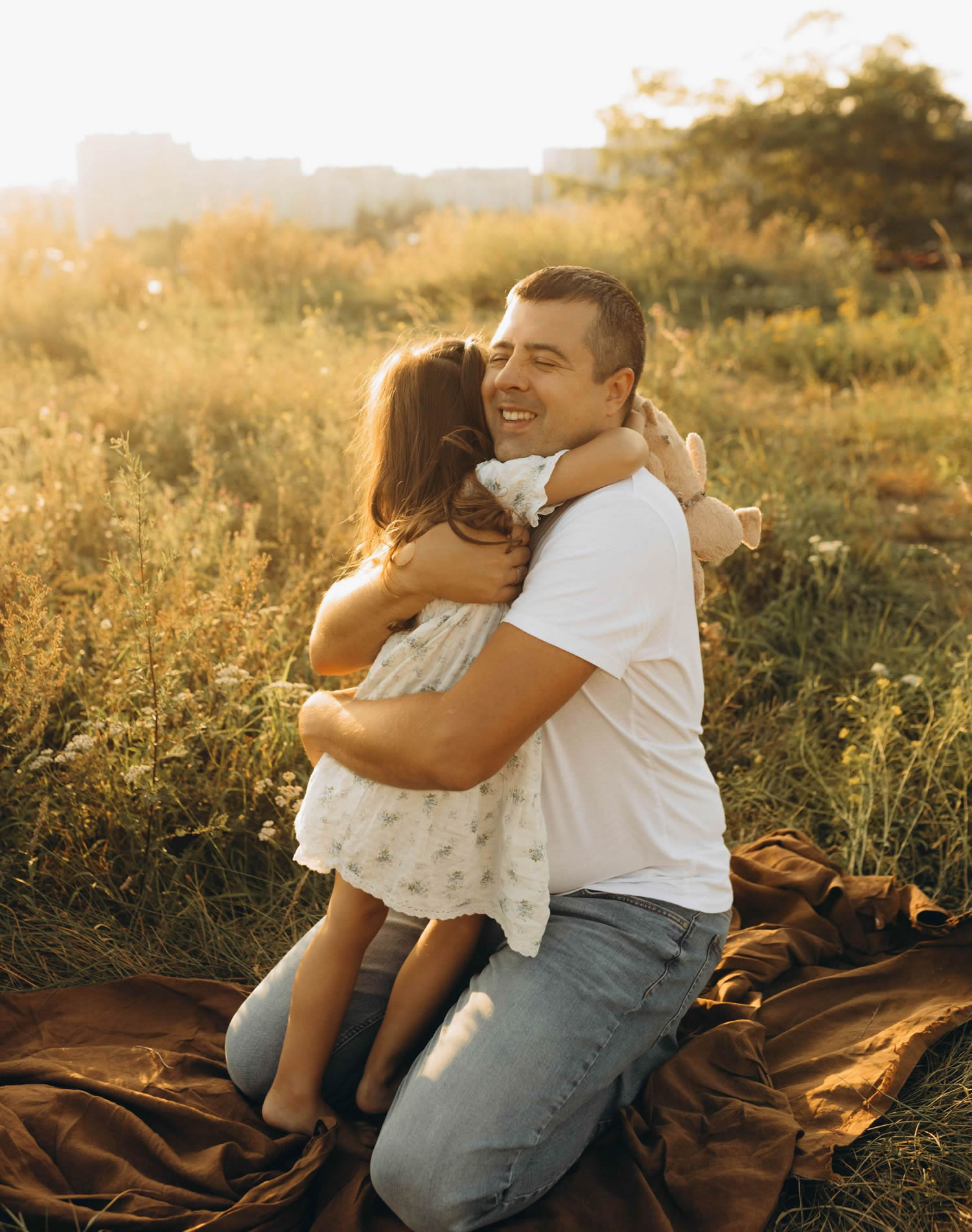 Dad hugging his daughter